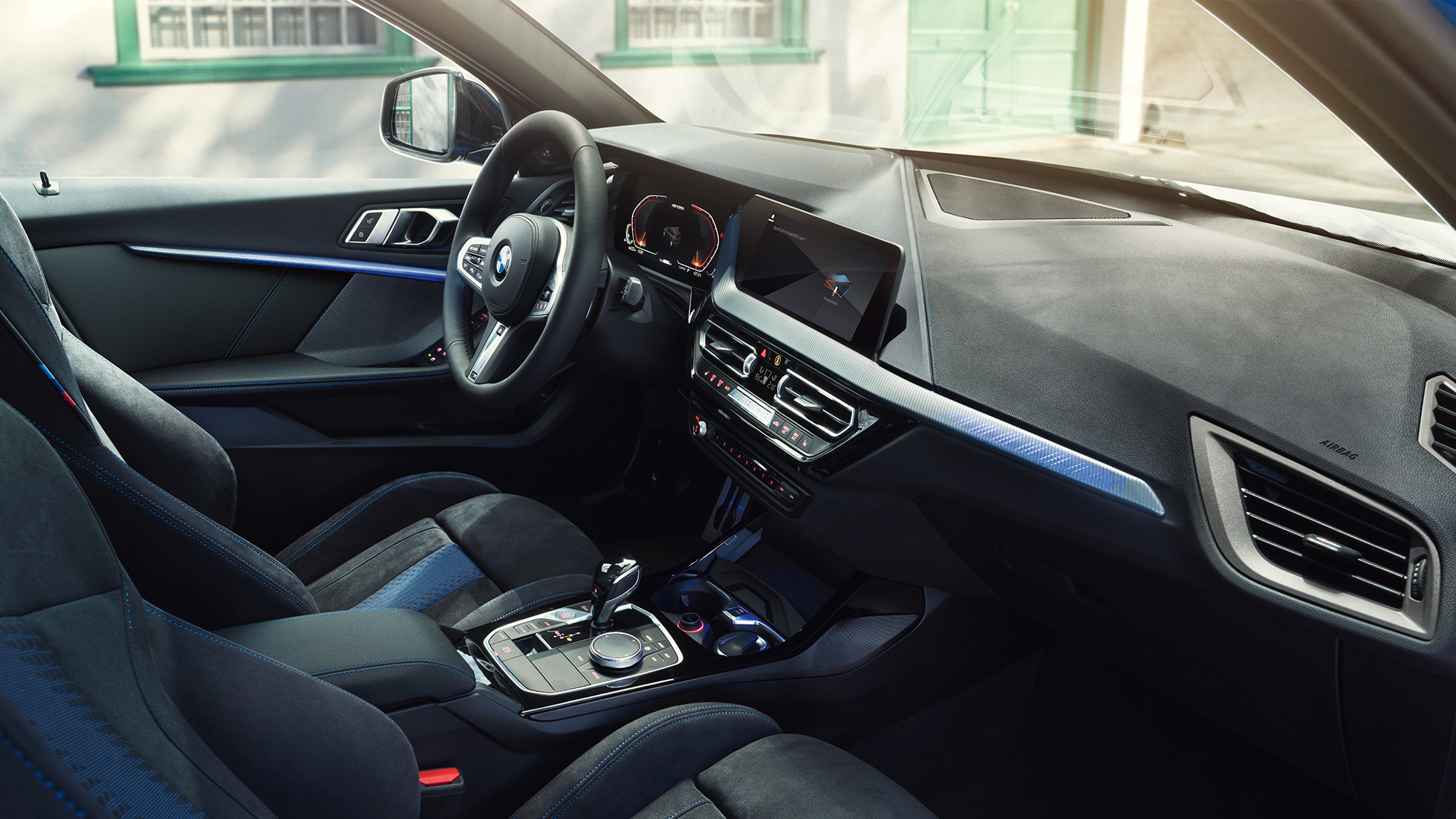 Sporty BMW 1 Series interior. BMW 1 Series cockpit with M Sport seats, M Leather steering wheal and illuminated interior trim finishers.